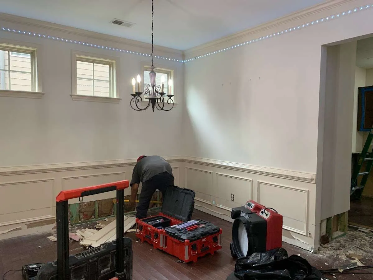 Restoration technician with professional equipment in Elsmere